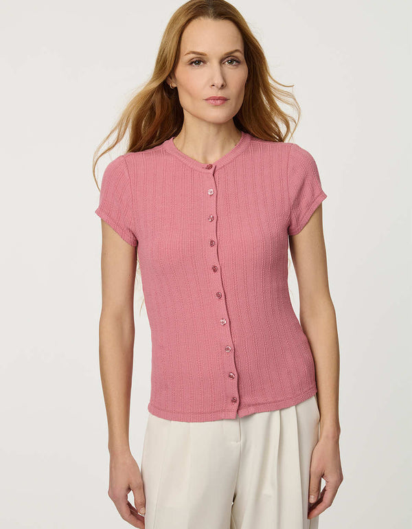 Woman wearing fitted Ribbed Button-Down Tee with short sleeves and full front button closure.