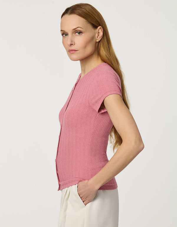 Woman wearing fitted Ribbed Button-Down Tee with short sleeves and full front button closure.