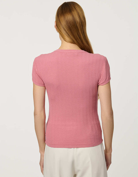 Woman wearing fitted Ribbed Button-Down Tee with short sleeves and full front button closure.