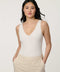 Women’s fitted jersey V-neck bodysuit in Bright White with sleeveless silhouette and smooth finish.