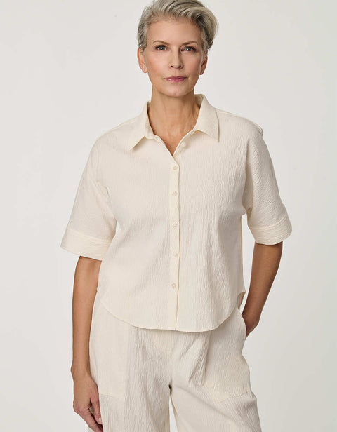 Women’s Gardenia seersucker button-up shirt with short dolman sleeves and relaxed fit.
