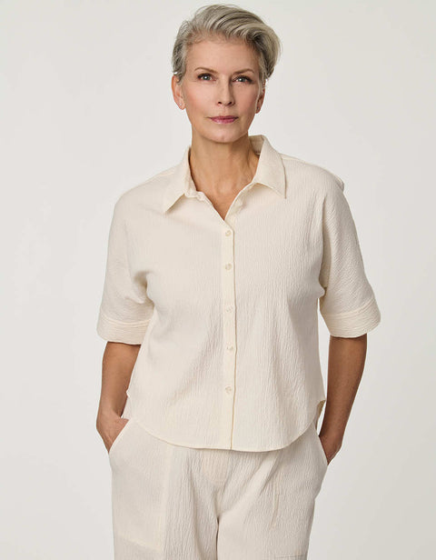 Women’s Gardenia seersucker button-up shirt with short dolman sleeves and relaxed fit.