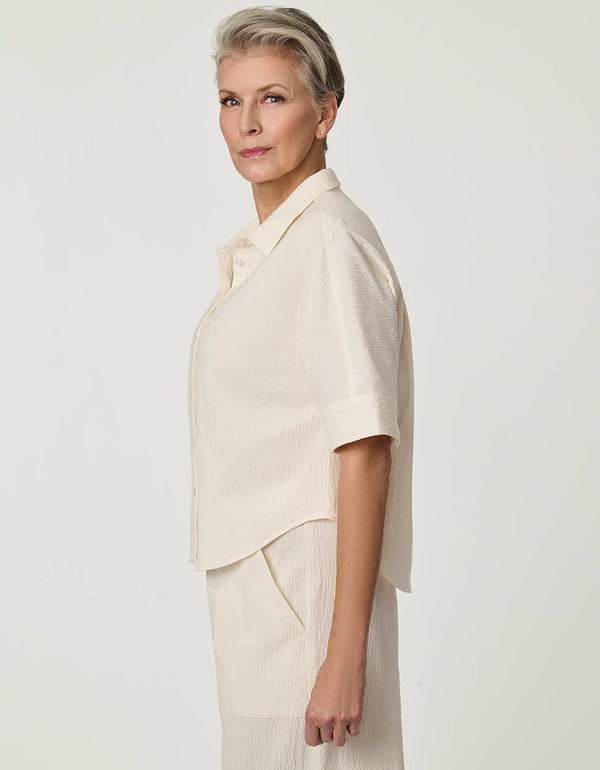 Women’s Gardenia seersucker button-up shirt with short dolman sleeves and relaxed fit.