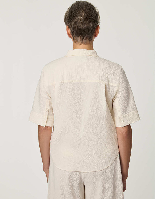 Women’s Gardenia seersucker button-up shirt with short dolman sleeves and relaxed fit.