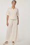 Women’s Gardenia seersucker button-up shirt with short dolman sleeves and relaxed fit.