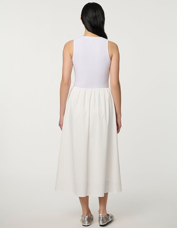 Women’s bright white eyelet midi dress with fitted perforated knit bodice and flowy A-line skirt.