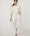 Women’s bright white cropped poplin shirt with short sleeves, button front, patch pockets, and relaxed fit.