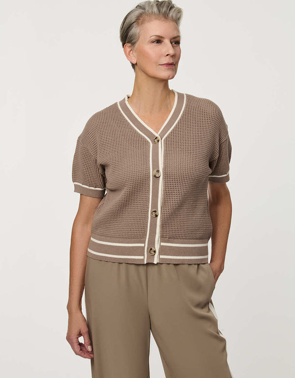Woman wearing short-sleeve Basketweave Knit Cardigan with textured knit pattern and contrast trim detailing.