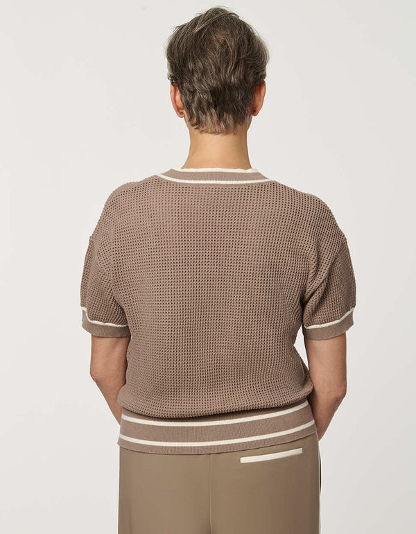 Woman wearing short-sleeve Basketweave Knit Cardigan with textured knit pattern and contrast trim detailing.