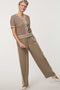 Woman wearing short-sleeve Basketweave Knit Cardigan with textured knit pattern and contrast trim detailing.