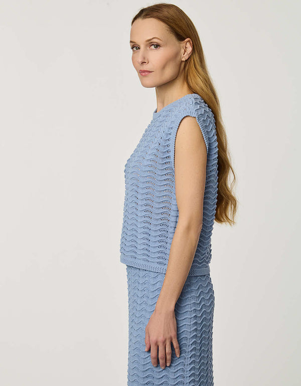 Women’s sleeveless wave knit top in blue with textured open-knit pattern.