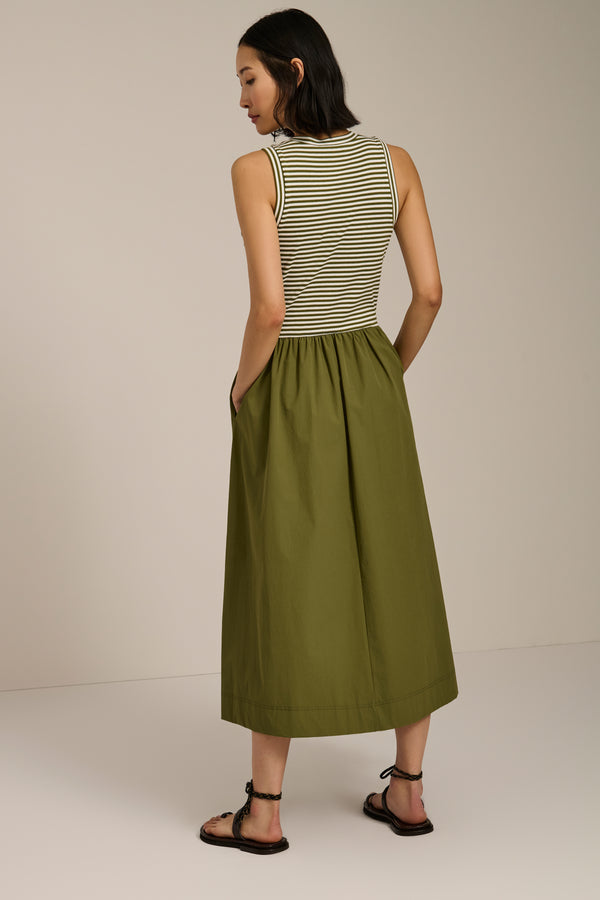 Woman wearing striped sleeveless midi dress with knit bodice and full poplin skirt.