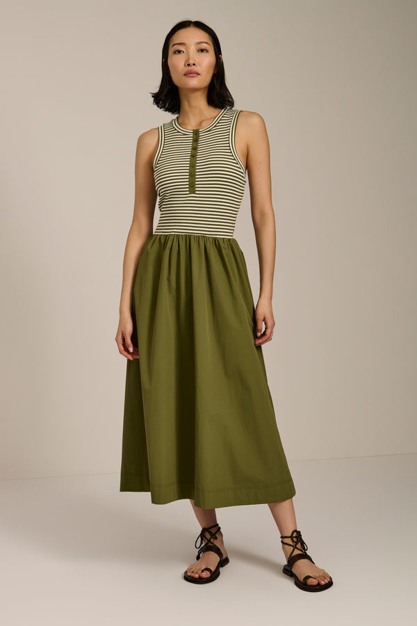 Woman wearing striped sleeveless midi dress with knit bodice and full poplin skirt.