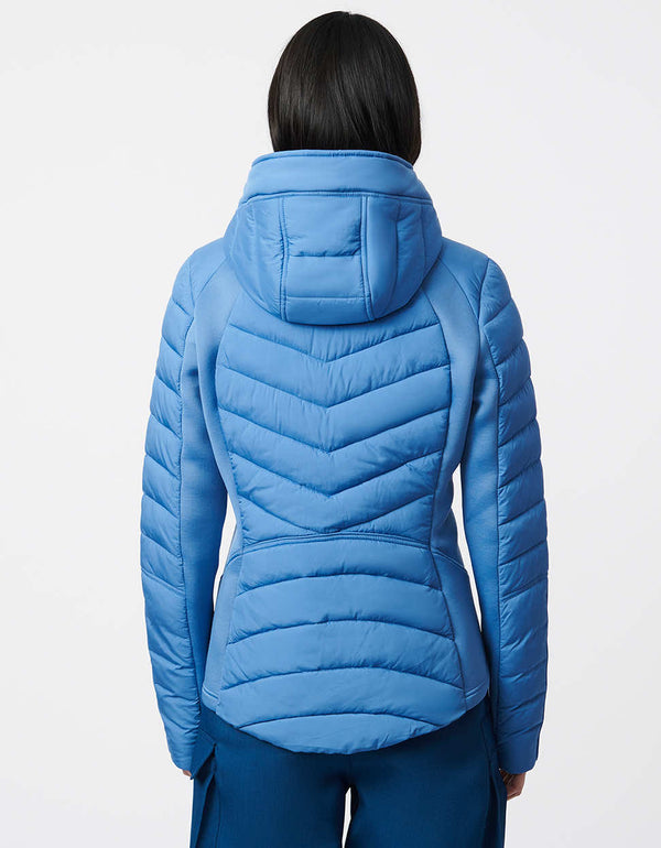 sustainable filler puffer jacket in blue that is lightweight and stylish for women