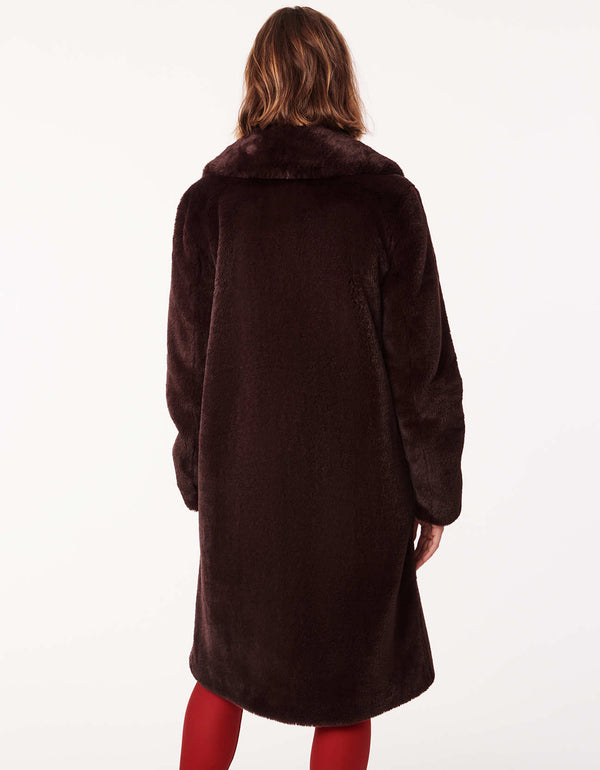 Women's long faux fur coat for an elevated look. Soft plush warmth for day or night.