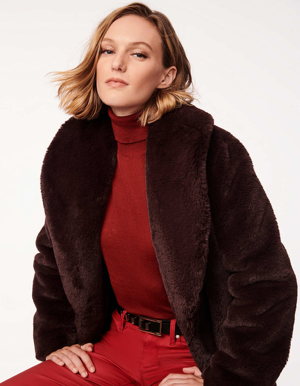 cherry wood faux fur coat offering rich warm tones plush fabric and practical features for a standout winter look