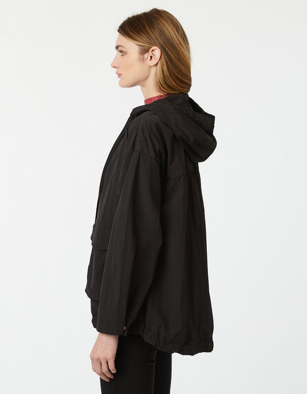 boxy black womens windbreaker with convertible drawstring bottom that is perfect for urban life