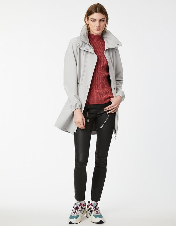 ward off weather in this high neck pearl grey raincoat with double button closure