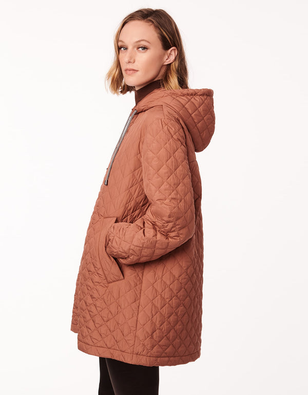 rich tan lightweight quilted jacket with drawstring hood cinched cuffs and slanted hand pockets as womens winter cloth