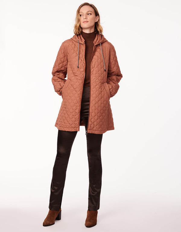 rich tan boxy quilted jacket made for lightweight layering with allover quilting in a sustainable filler as womens outerwear