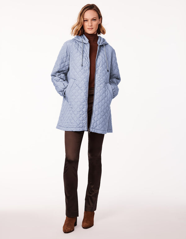 light blue boxy quilted jacket made for lightweight layering with allover quilting in a sustainable filler as womens outerwear
