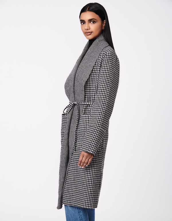 long wool coat in black and white houndstooth pattern with belt and oversized pockets as womens outerwear this 2022