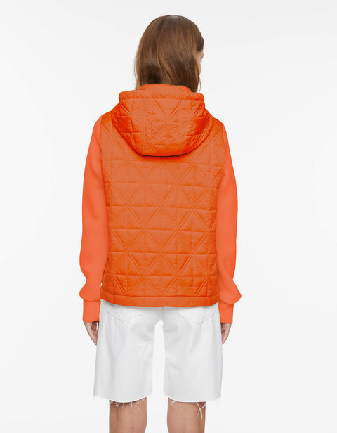 hooded womens orange puffer with oversize fit drawstring hood cuffs and slanted hand pockets as outerwear during spring 
