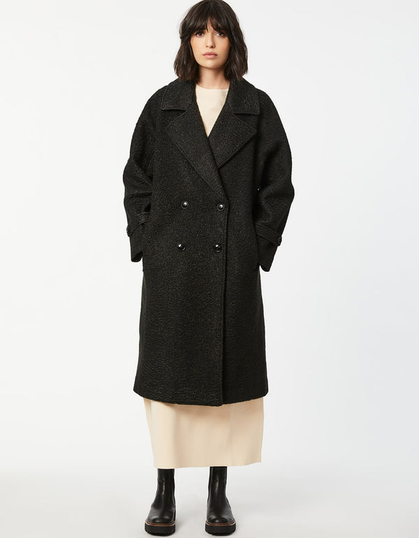 black double breasted wool coat for women that is lightweight and roomy for fall collection 2023