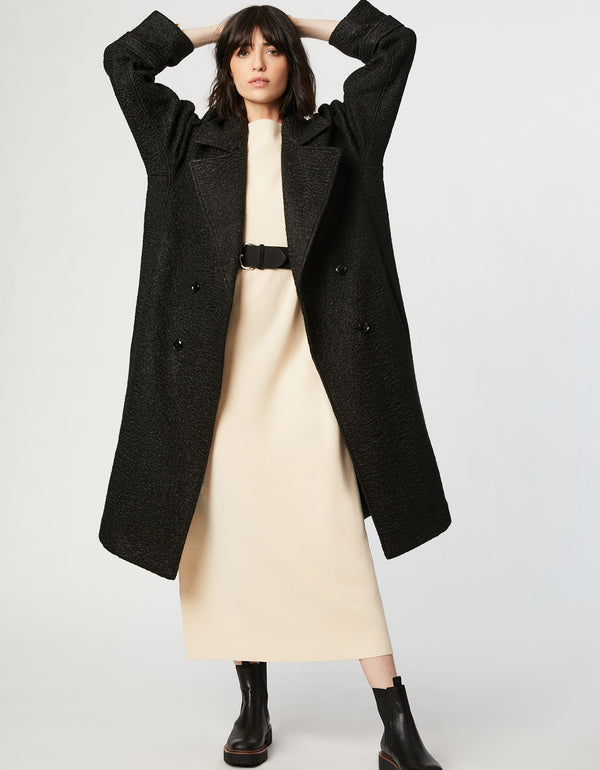easy to style double breasted wool coat for busy and chic women with an oversized knee length fit