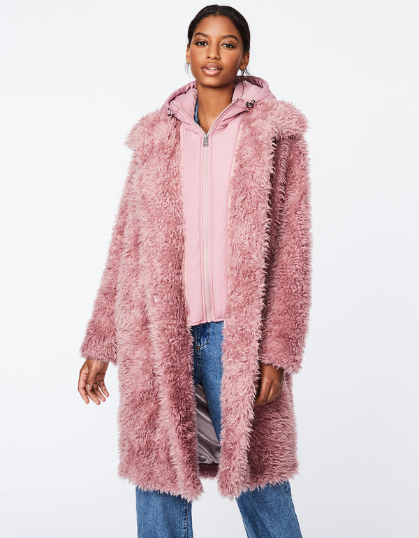 pink faux fur double coat outerwear for women that has a shearling inspired faux design and attached pink zip up vest for extra warmth