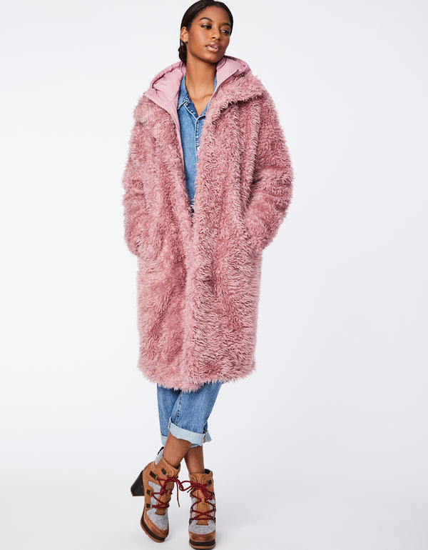 classic pink fur coat for women that is practical to wear everyday because it keeps you warm and safe from the rain