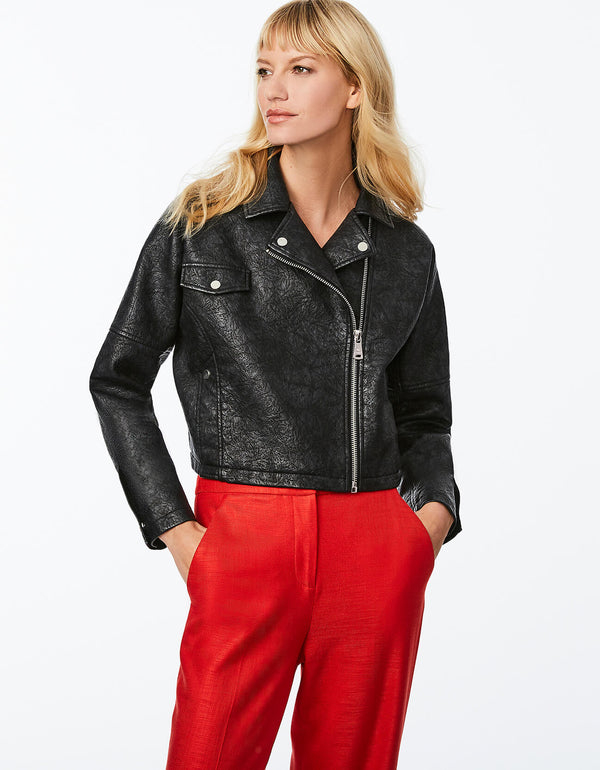 cool black faux leather jacket for women with snap flap pockets at the chest and waist for a chic fit