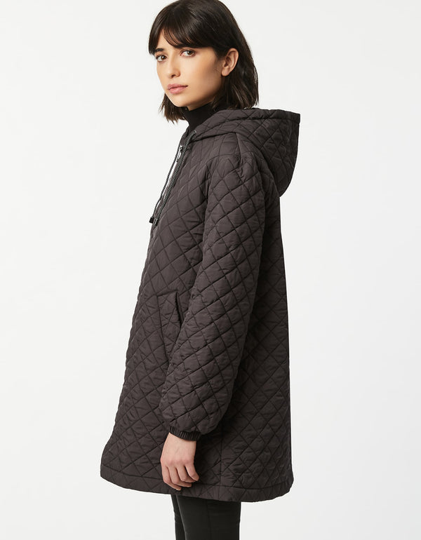 dark grey boxy quilted jacket made for lightweight layering with allover quilting in a sustainable filler