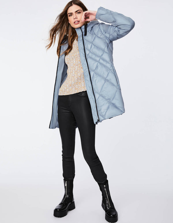 light blue machine wash safe puffer coat for women made with recycled polyester and cruelty free materials