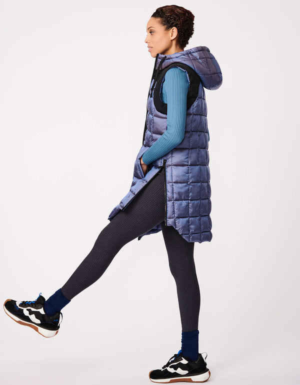 easy to pack and non bulky hooded puffer vest for women in violet with slit pockets for a warm spring and fall