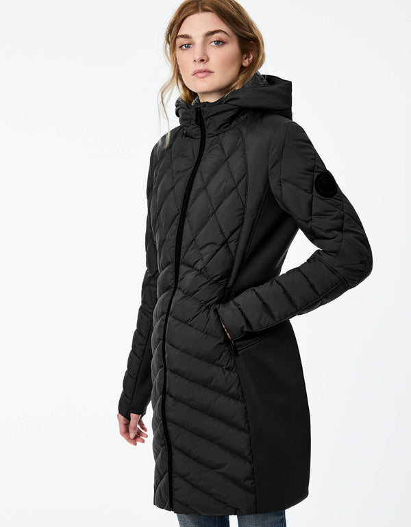 soft and lightweight sports puffer jacket with zip out vest in black for active women in the city during winter