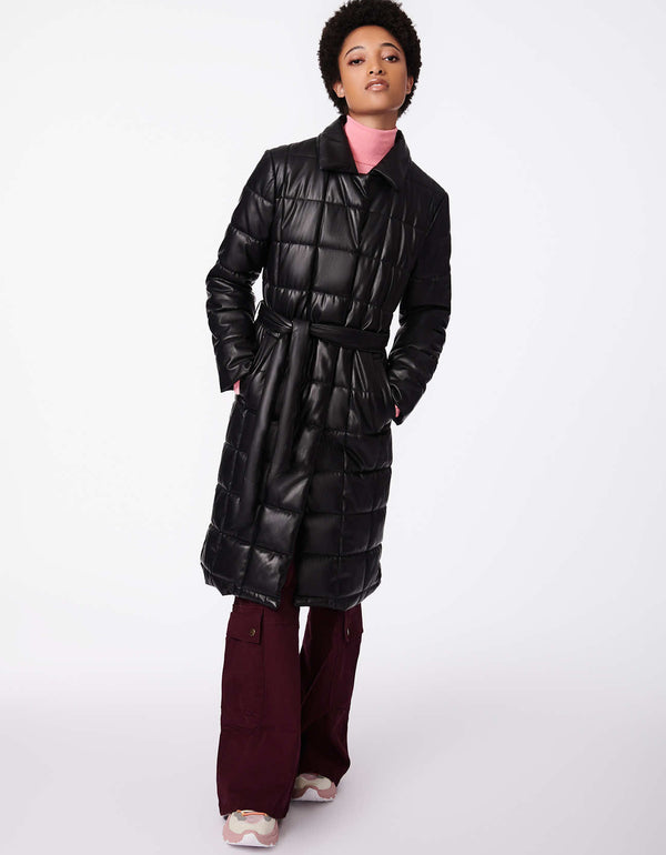 sustainable knee length vegan puffer coat in black designed with 13 inch back vent to highlight the walker style