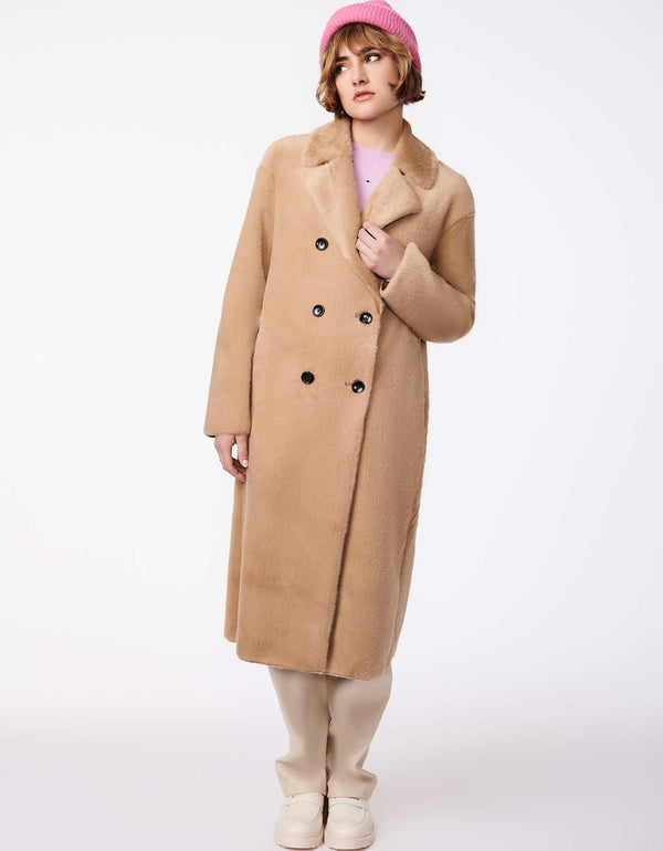 long maxi coat in light brown color in a double breasted silhouette then crafted it the softest vegan fur