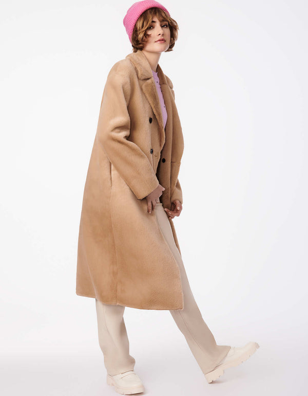 tan maxi coat for winter in vegan fur and suede with oversized style and length room for easy layering