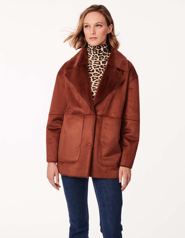 ginger red orange colored jacket with vegan shearling in lightweight style and concealed snap closures and ample hand pockets