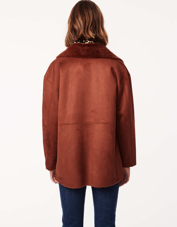 winter fashion for women should include this lightweight ginger red orange jacket with vegan shearling