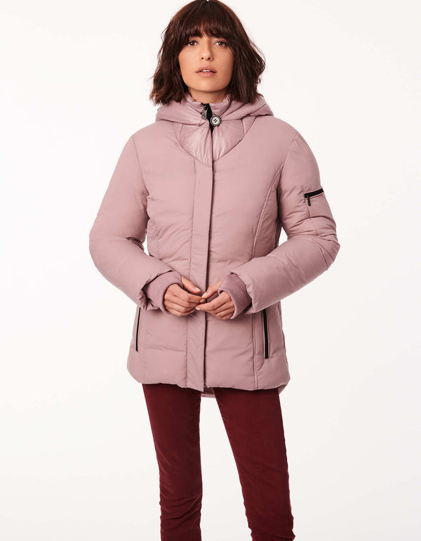 non bulky heavy winter puffer jacket in light pink with eco friendly insulation with an attached inner bib and collar and sleeve pocket