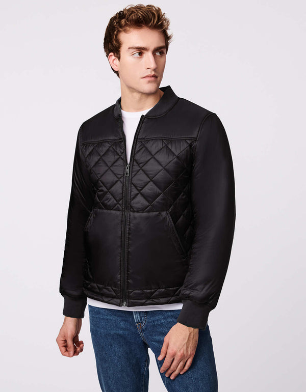 stay warm in a quilted mens puffer jacket for winter in black with EcoPlume insulation made by a sustainable outerwear brand