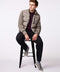 mens puffer jacket that comes with knit sleeves EcoPlume insulation and vertical zipper on the chest pocket in grey