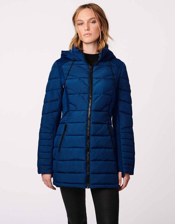 womens blue padded coat made from polyester and spandex as well as recycled plastic bottles