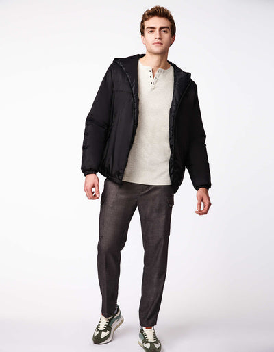 warm winter coats for men are here in a black puffer jacket made with EcoPlume insulation and 4 zipper pockets