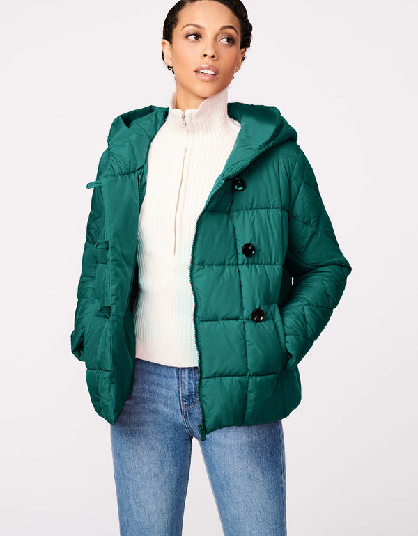 hooded puffer jacket for women that is kelly green colored it is soft lightweight and water resistant