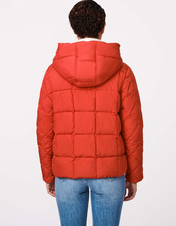 winter time red puffy outerwear for women that is warm and sustainable perfect for fall to winter season