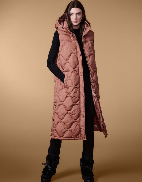 modern womans trendy puffer vest for winter season in a walker length with oversized fit for comfort