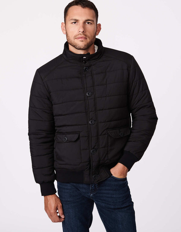 black puffer jacket with knit cuffs and patch hand pockets that act as utility feature and hand warmers as outerwear for men